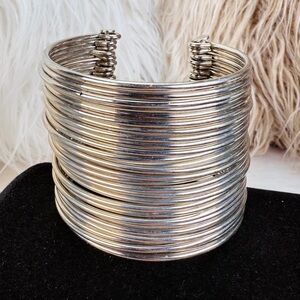 Vintage unique, Silvertone multi band 28 piece, weighted wide band cuff bracelet